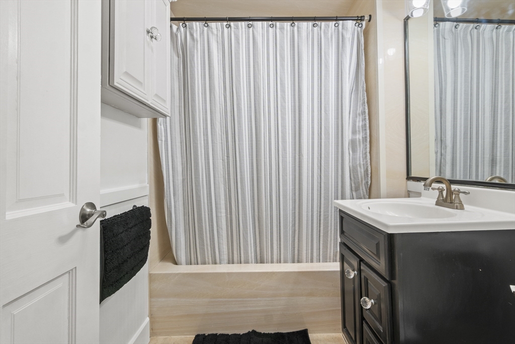 31 Madison Street Lynn, MA 01902 - Photo 15 of 30 a bathroom with a sink and a mirror