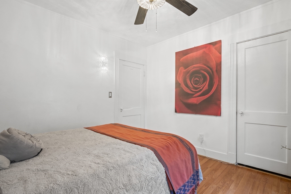 31 Madison Street Lynn, MA 01902 - Photo 18 of 30 a bedroom with a bed and a painting on the wall