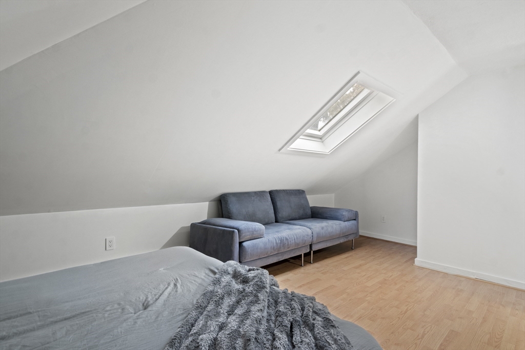 31 Madison Street Lynn, MA 01902 - Photo 25 of 30 a living room with furniture and a window