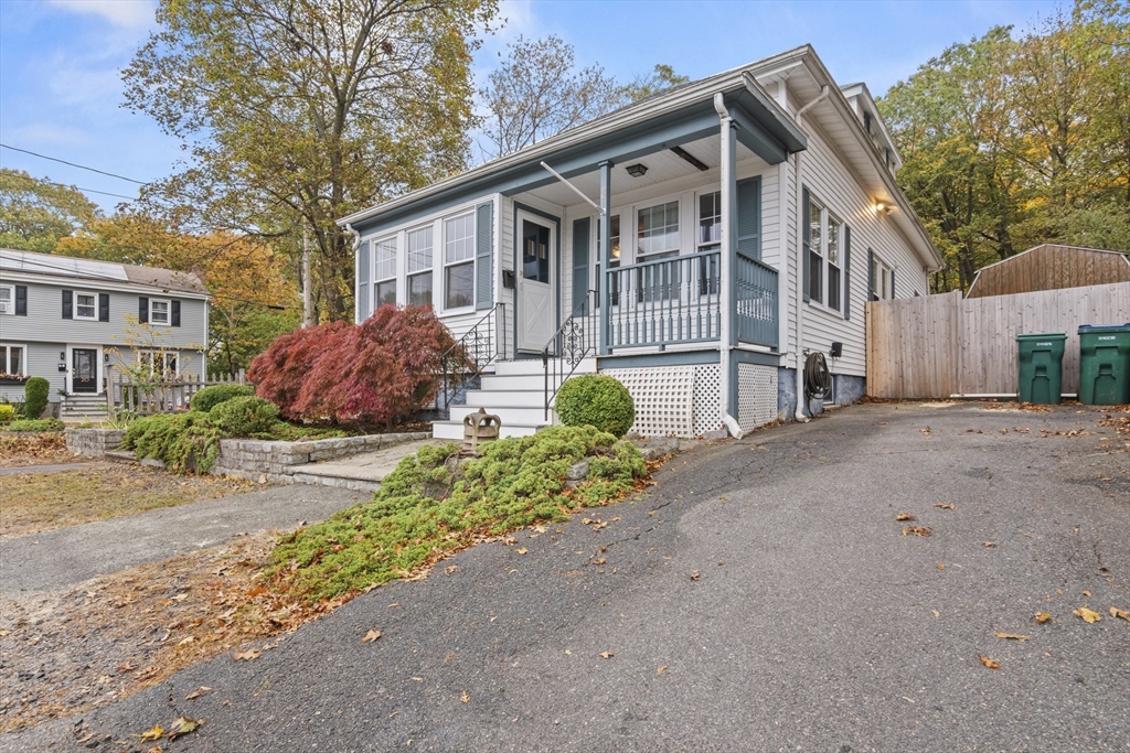 31 Madison Street Lynn, MA 01902 - Photo 30 of 30 a front view of a house with a yard and a garage