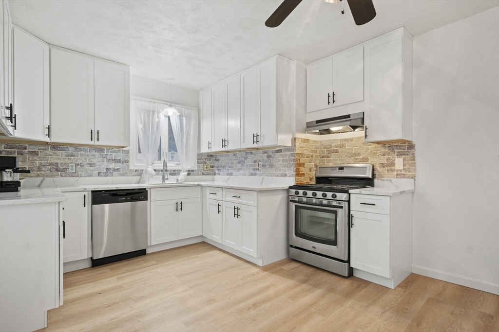 31 Madison Street Lynn, MA 01902 - Photo 10 of 30 a kitchen with appliances cabinets and a sink