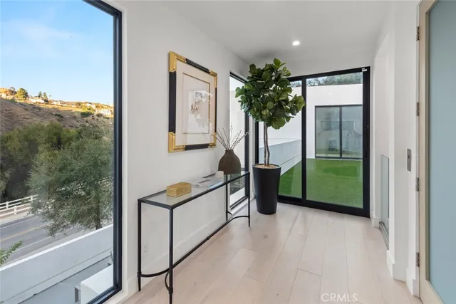 a view of yard from terrace with seating area