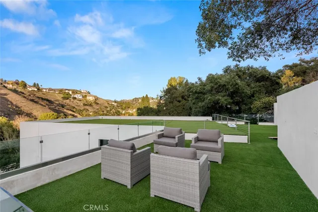 a view of a swimming pool with lounge chairs
