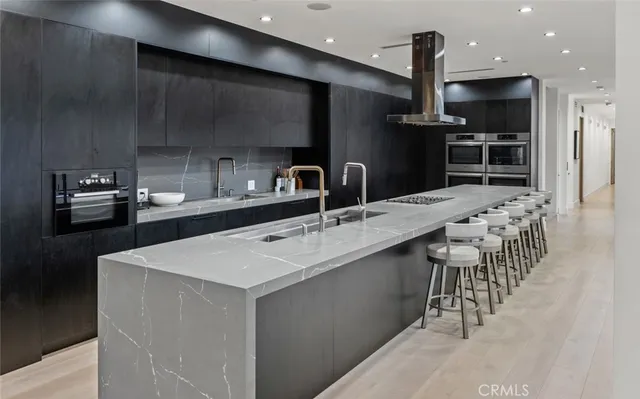 a kitchen with stainless steel appliances granite countertop lots of counter top space