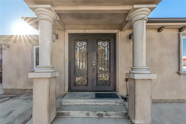 a kitchen with a table chairs sink and cabinets