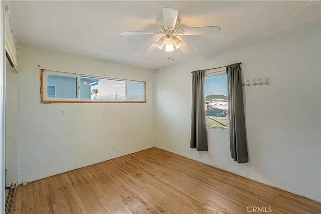 a bedroom with a bed and a desk