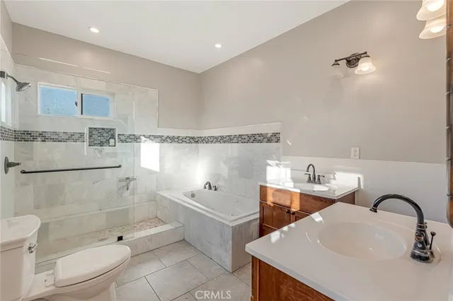 a bathroom with a sink vanity and mirror