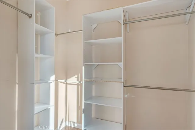 a aerial view of a house with a big yard plants and large tree