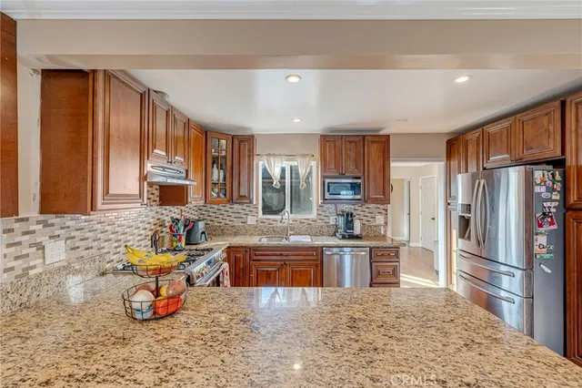 a kitchen with large windows
