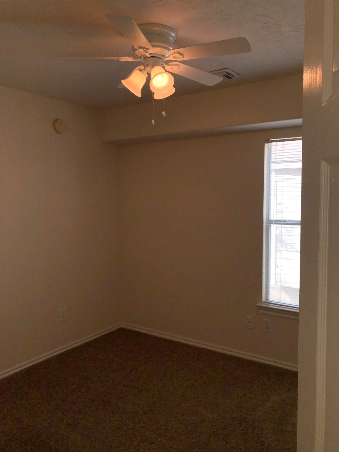5639 Stonecloud Lane Katy, TX 77494 - Photo 39 of 43 Third upstairs bedroom with ceiling fan and light kit and closet.