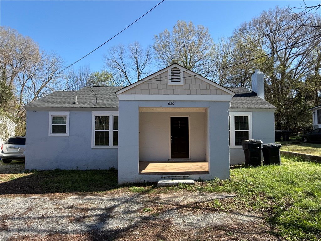 This charming home features a welcoming porch, perfect for enjoying sunny afternoons.
