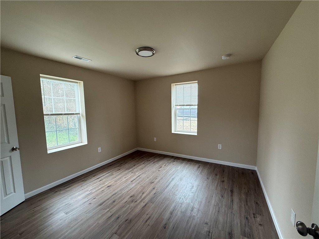 620 East Orr Street Anderson, SC 29621 - Photo 13 of 22 This airy room features durable flooring and ample natural light, creating a comfortable living space.