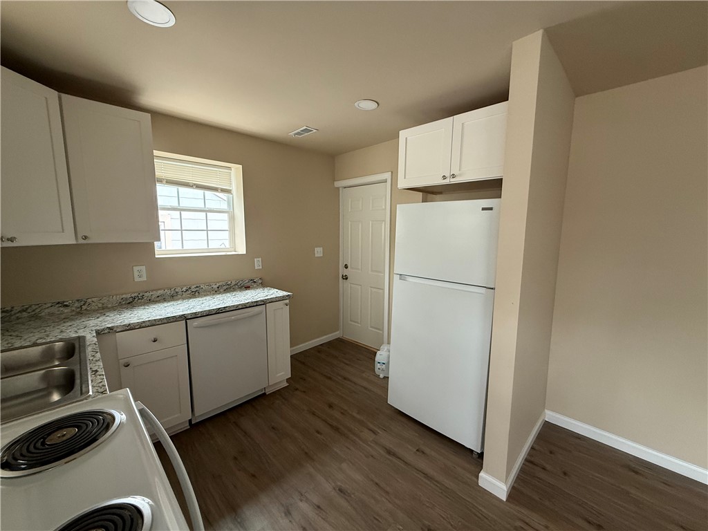 620 East Orr Street Anderson, SC 29621 - Photo 8 of 22 This kitchen features sleek countertops and modern appliances, perfect for everyday living.