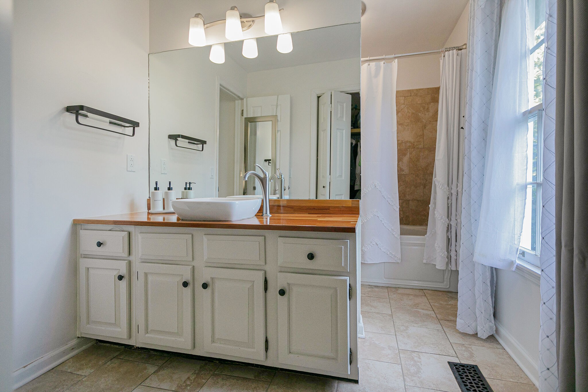 212 Gloucester Street Franklin, TN 37064 - Photo 15 of 23 a bathroom with a double vanity sink and a mirror