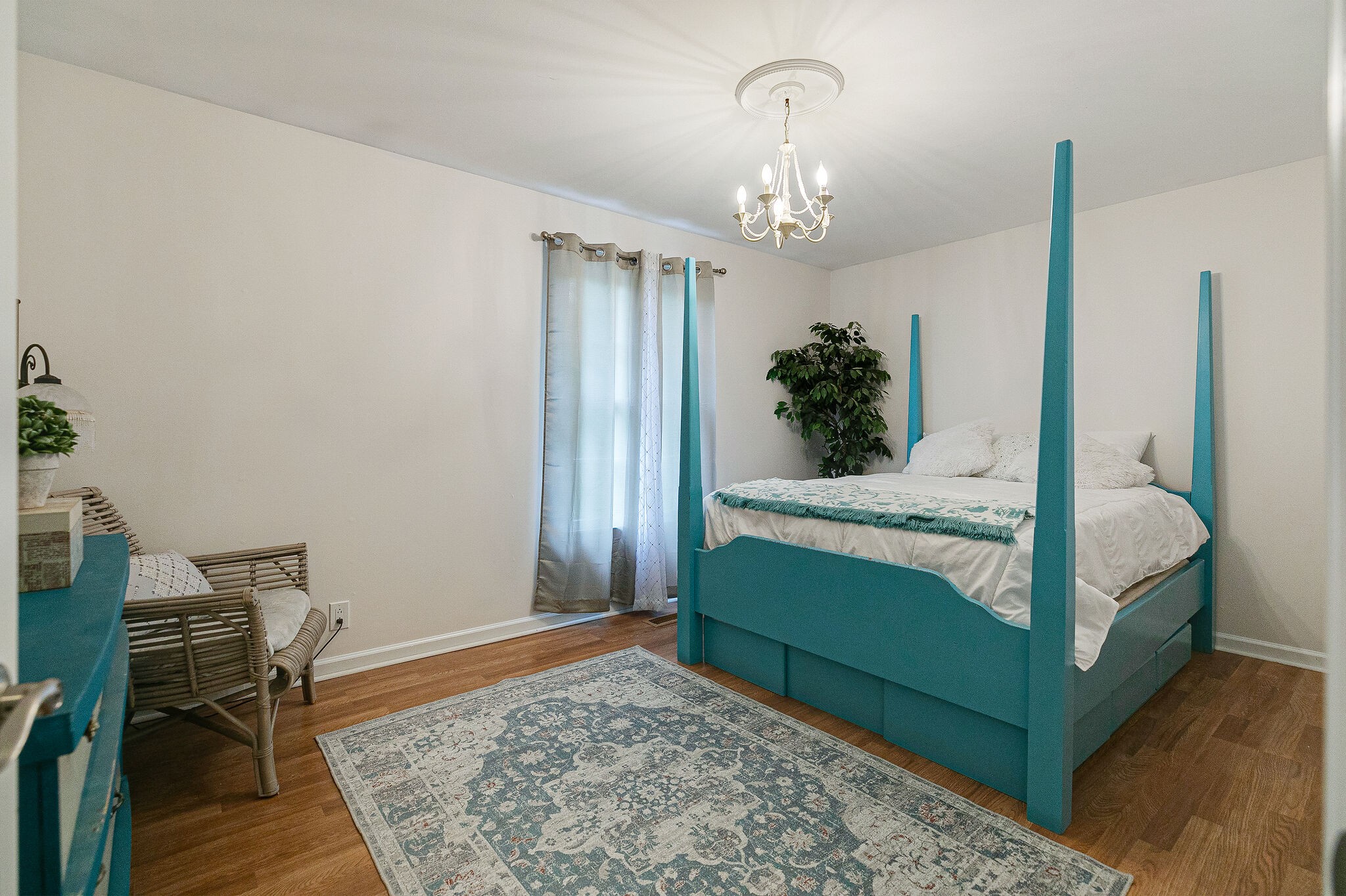 212 Gloucester Street Franklin, TN 37064 - Photo 17 of 23 a bedroom with a bed and a chandelier