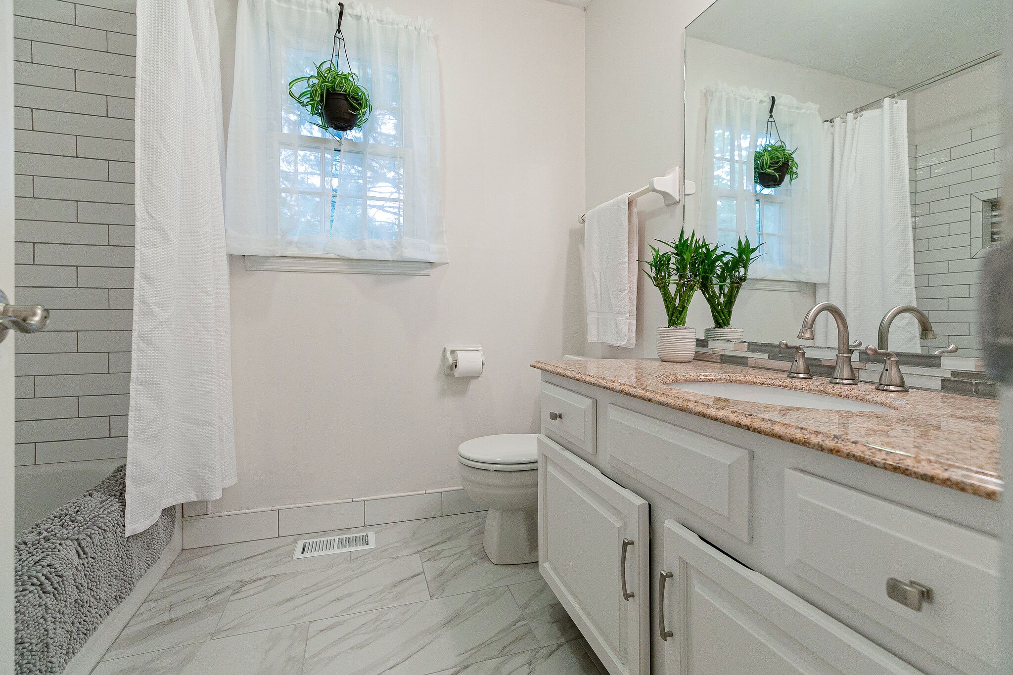 212 Gloucester Street Franklin, TN 37064 - Photo 18 of 23 a bathroom with a granite countertop sink and a mirror