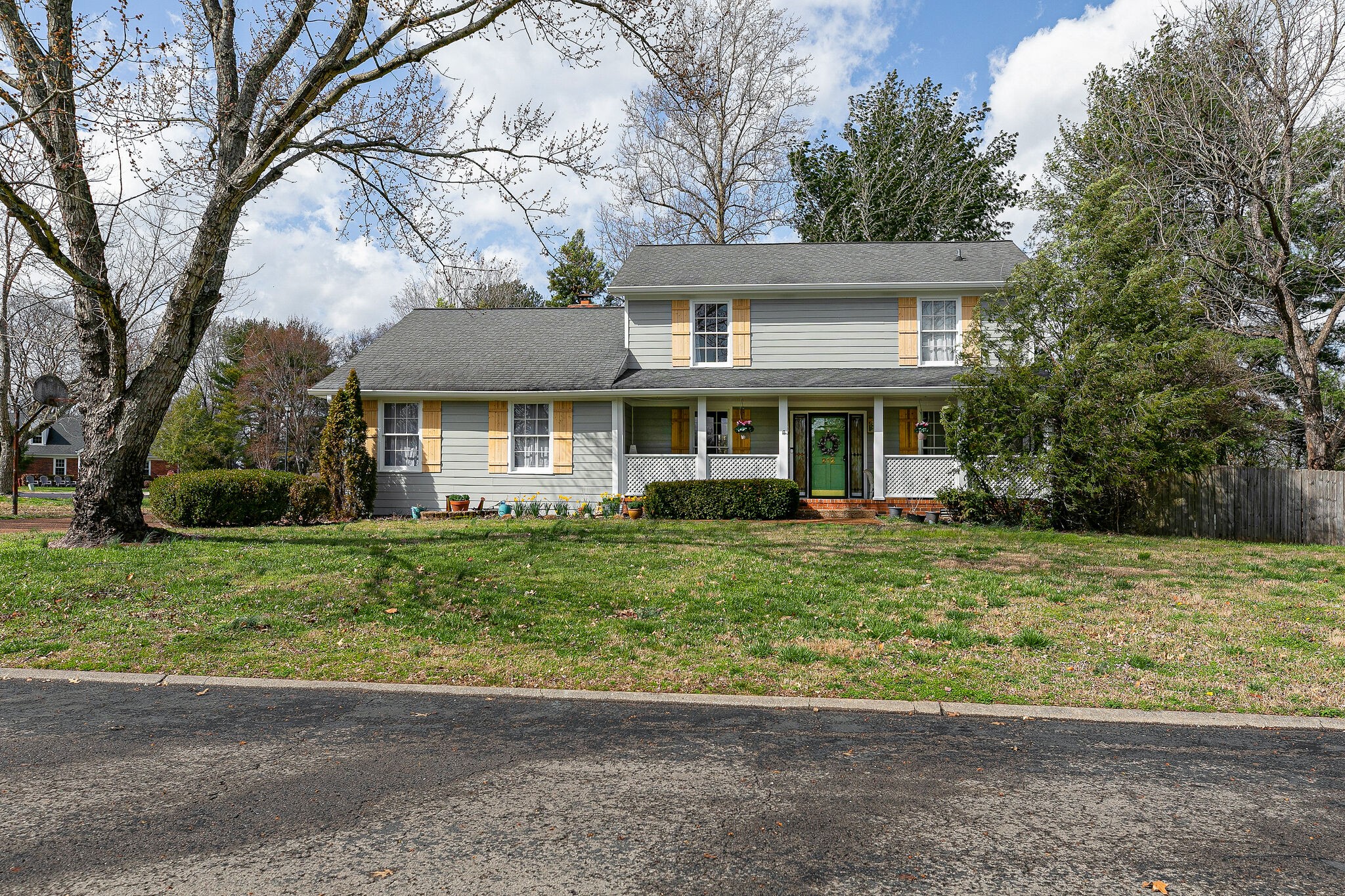 212 Gloucester Street Franklin, TN 37064 - Photo 4 of 23 a front view of a house with a garden