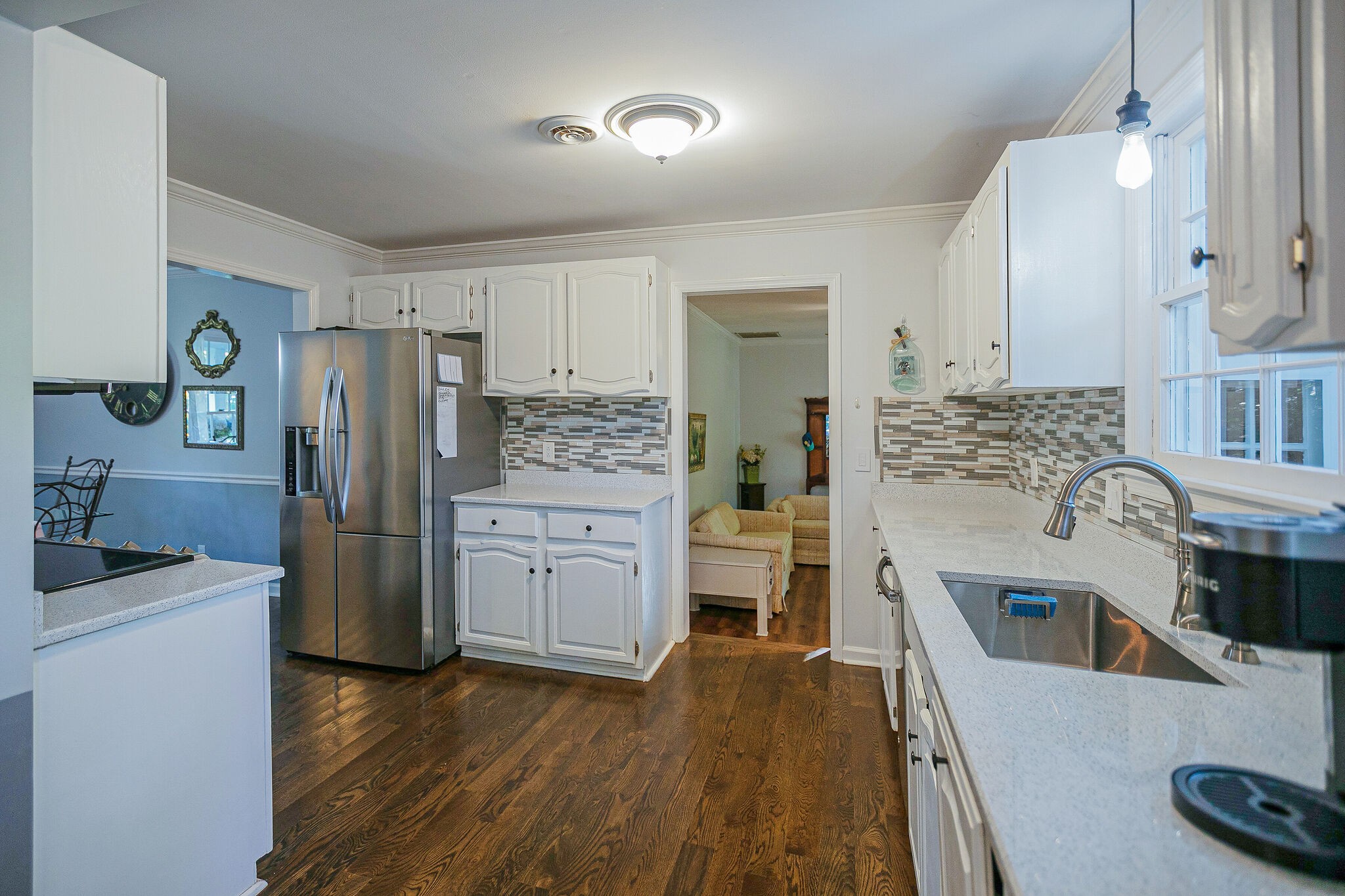212 Gloucester Street Franklin, TN 37064 - Photo 9 of 23 a kitchen with stainless steel appliances a stove a sink a refrigerator a cabinets and wooden floor