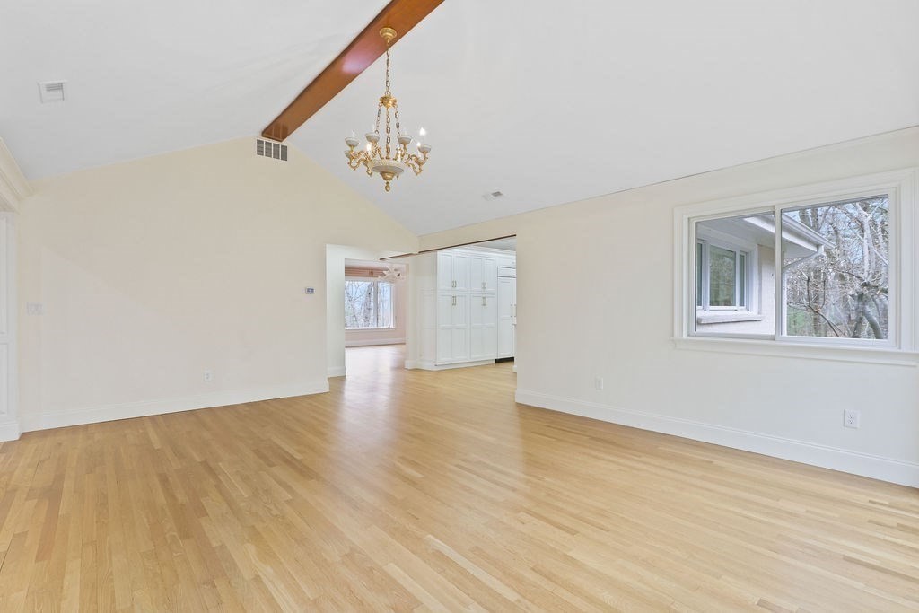80 Doublet Hill Road Weston, MA 02493 - Photo 17 of 38 a view of an empty room with wooden floor and a window