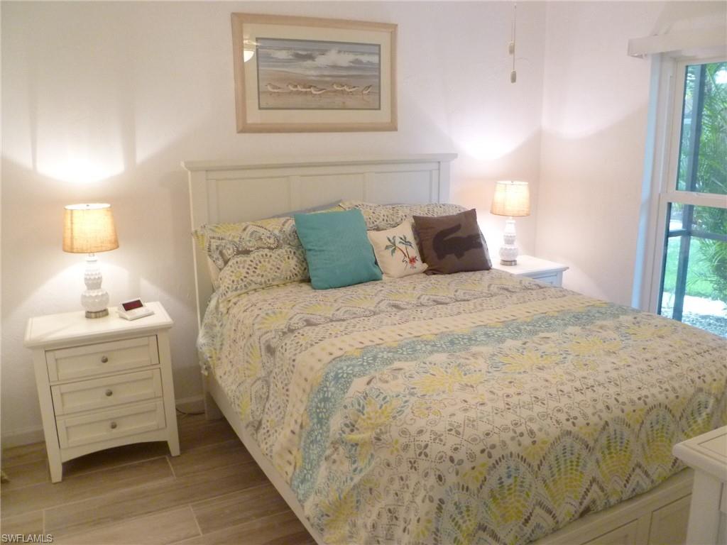762 San Marco Road, Unit 4108 Marco Island, FL 34145 - Photo 12 of 19 a large bed sitting in a bedroom next to a lamp