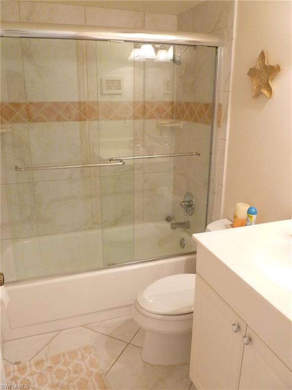 762 San Marco Road, Unit 4108 Marco Island, FL 34145 - Photo 16 of 19 a bathroom with a sink a toilet and shower