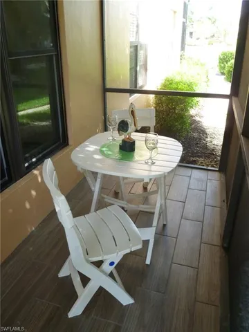 a view of a table and chairs in the patio