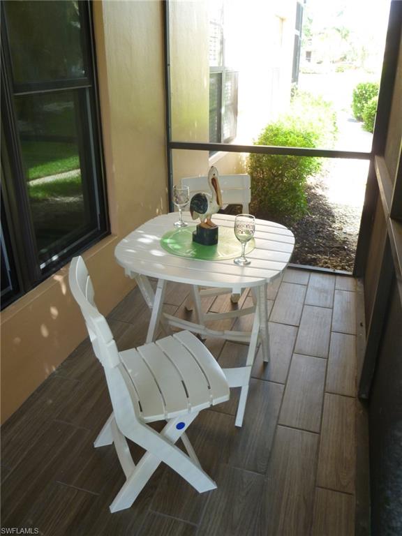 762 San Marco Road, Unit 4108 Marco Island, FL 34145 - Photo 19 of 19 a view of a table and chairs in the patio