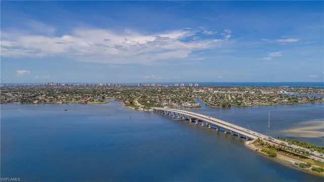 a view of an ocean and city