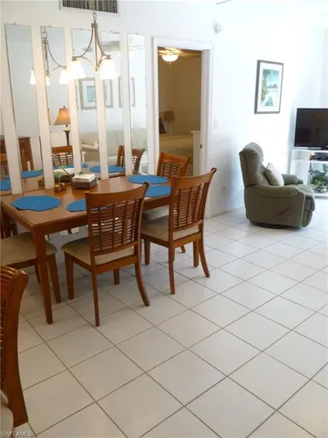a view of a livingroom with furniture and a flat screen tv