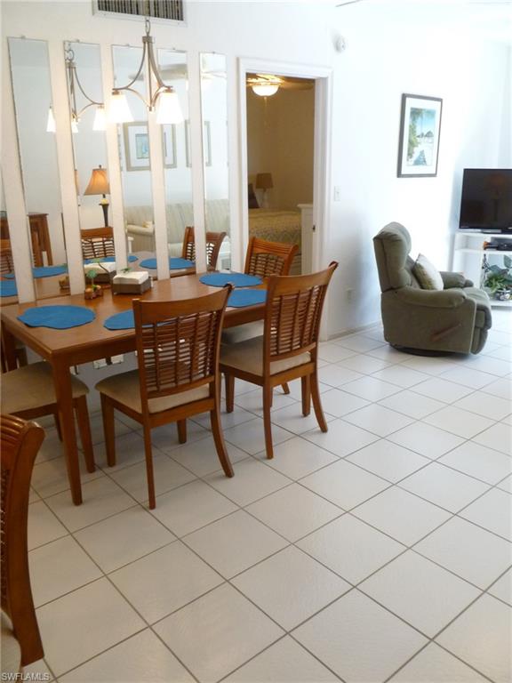 762 San Marco Road, Unit 4108 Marco Island, FL 34145 - Photo 10 of 19 a view of a livingroom with furniture and a flat screen tv