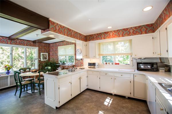 58 Lincoln Road Wellesley, MA 02481 - Photo 11 of 15 a kitchen with a sink stove and cabinets