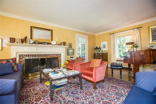 58 Lincoln Road Wellesley, MA 02481 - Photo 5 of 15 a living room with furniture fireplace and a table