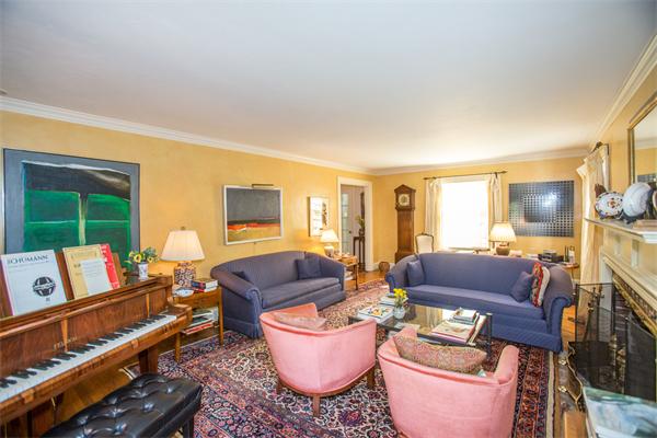 58 Lincoln Road Wellesley, MA 02481 - Photo 6 of 15 a living room with furniture a flat screen tv and a window