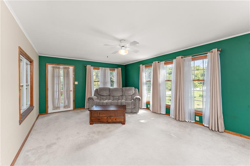 4792 Wexford Run Road Bradford Woods, PA 15015 - Photo 13 of 27 a living room with furniture and large windows