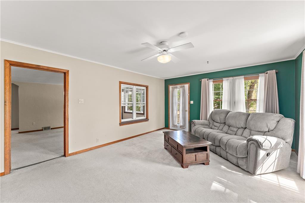 4792 Wexford Run Road Bradford Woods, PA 15015 - Photo 15 of 27 a living room with furniture and a window