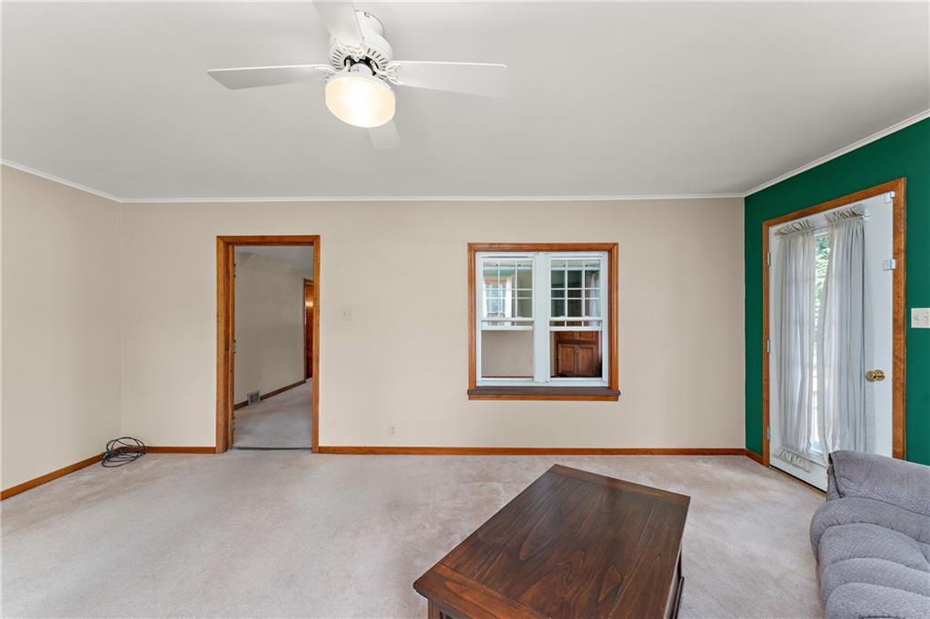 4792 Wexford Run Road Bradford Woods, PA 15015 - Photo 16 of 27 a livingroom with a ceiling fan and window