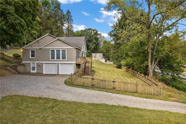 a view of a house with a yard