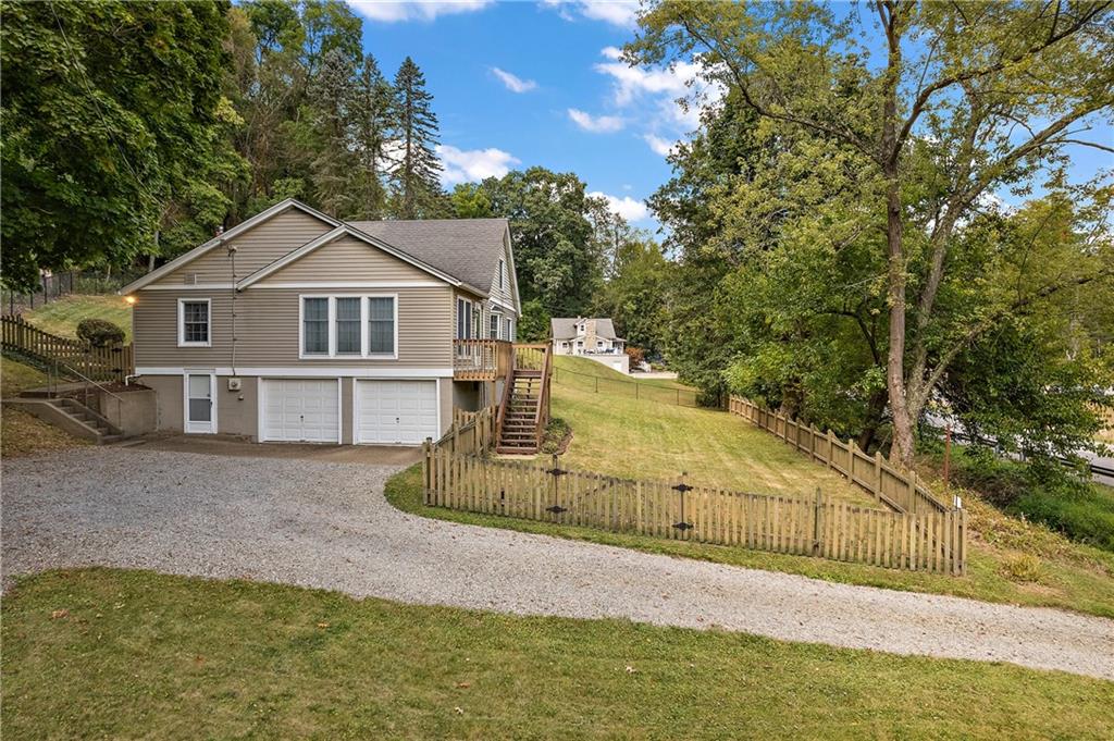4792 Wexford Run Road Bradford Woods, PA 15015 - Photo 5 of 27 a view of a house with a yard