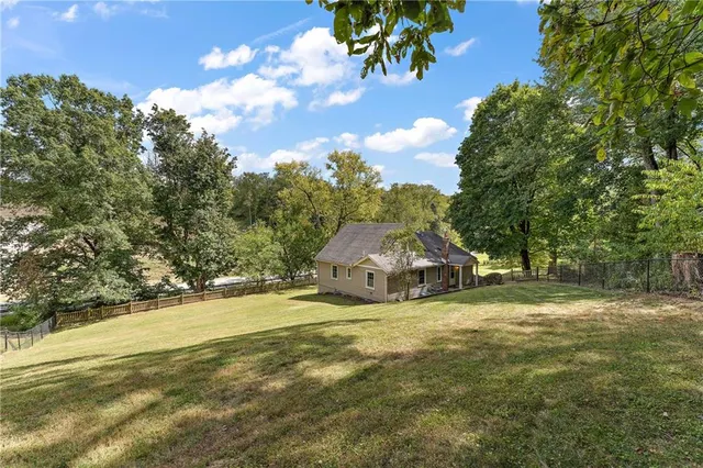 a view of a playground with a yard