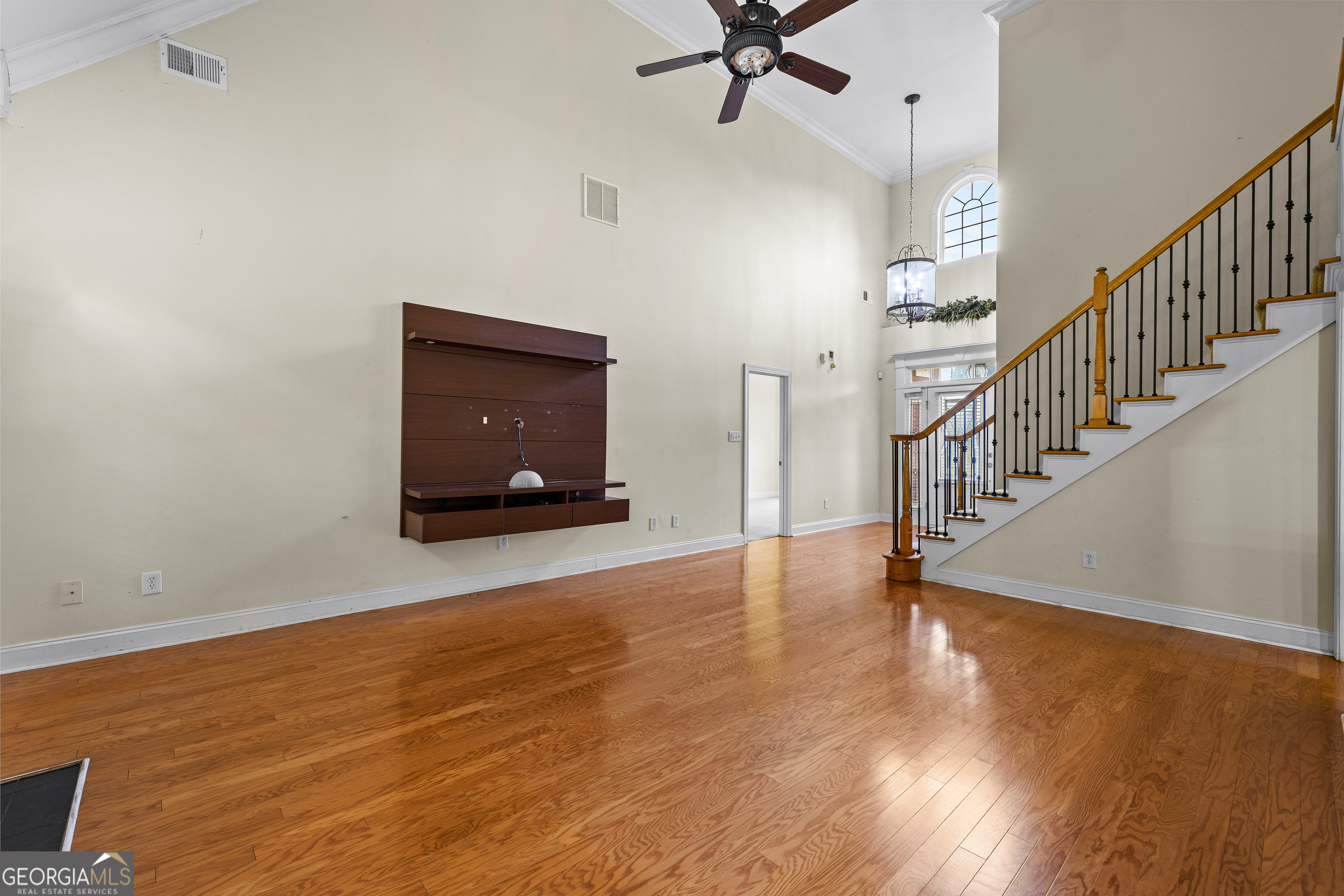 120 Shankhill Ridge Tyrone, GA 30290 - Photo 19 of 54 a view of a room with wooden floor windows and a ceiling fan