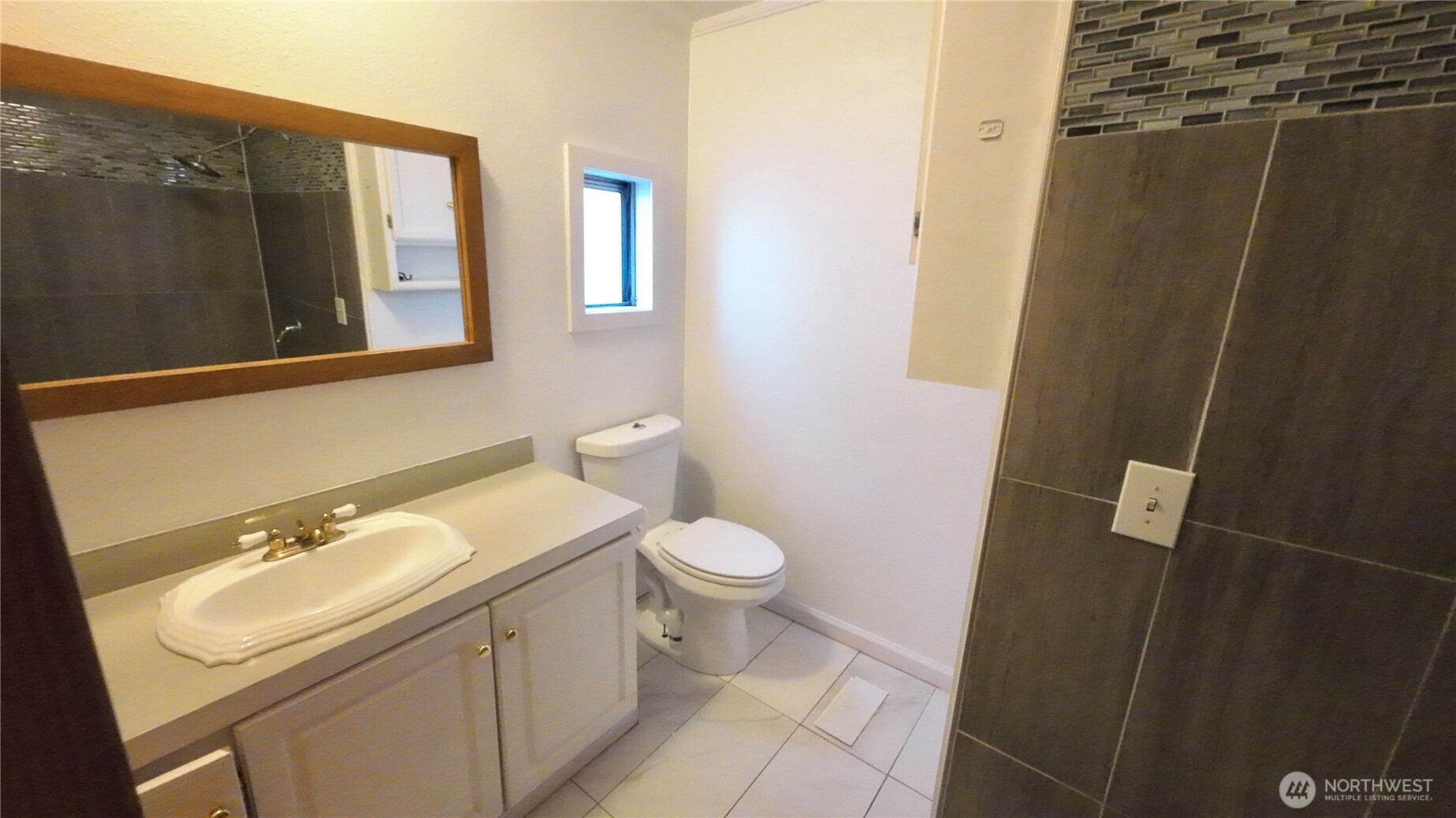 4672 Birch Bay Lynden Road, Unit 82 Blaine, WA 98230 - Photo 17 of 22 a bathroom with a sink a toilet and shower