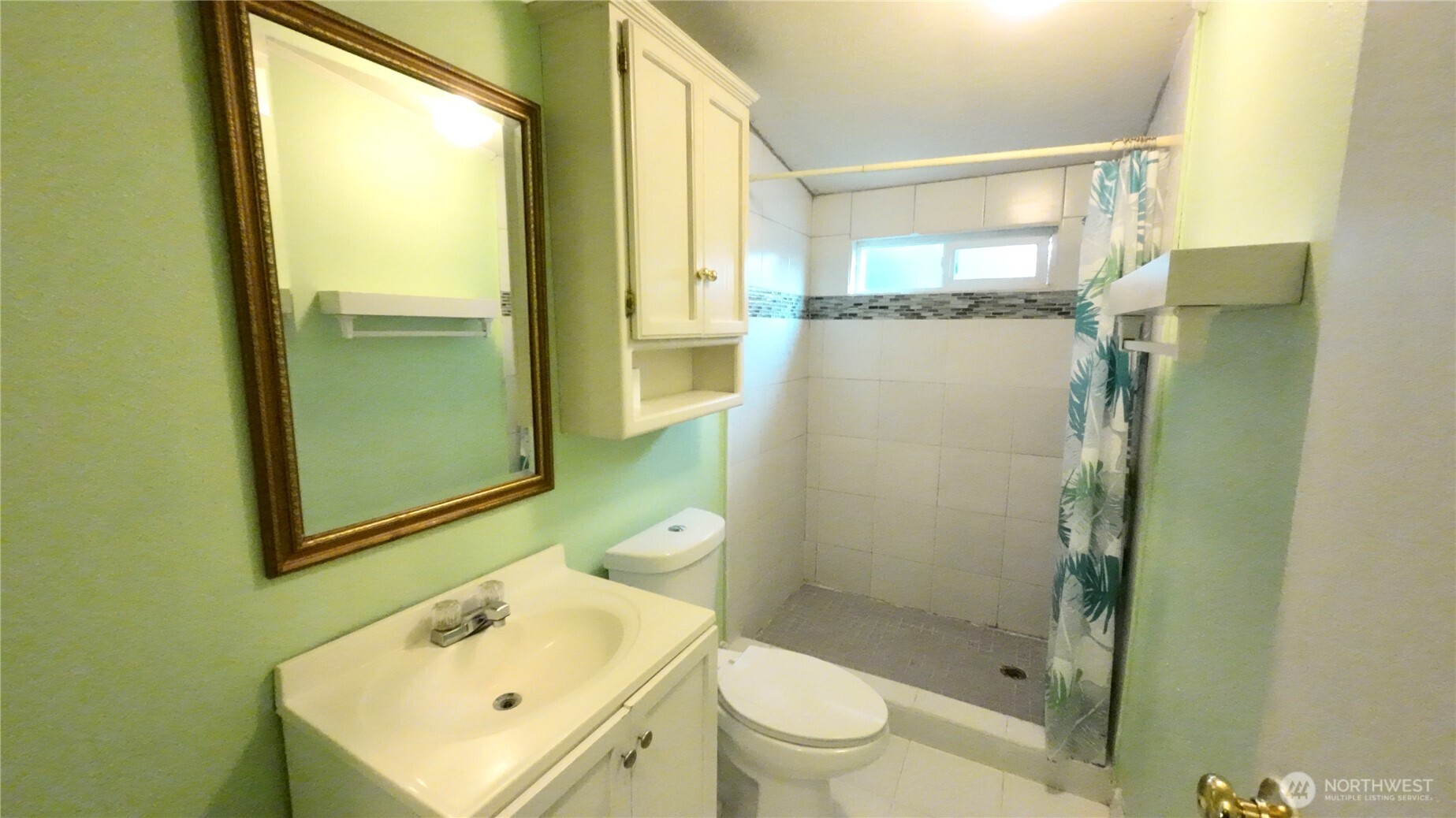 4672 Birch Bay Lynden Road, Unit 82 Blaine, WA 98230 - Photo 19 of 22 a bathroom with a sink toilet and shower