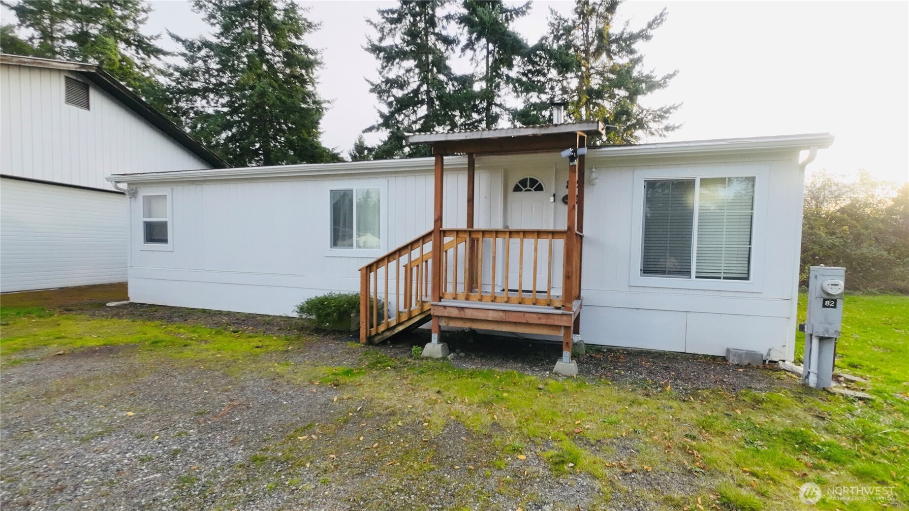 4672 Birch Bay Lynden Road, Unit 82 Blaine, WA 98230 - Photo 2 of 22 a view of a house with a backyard and deck