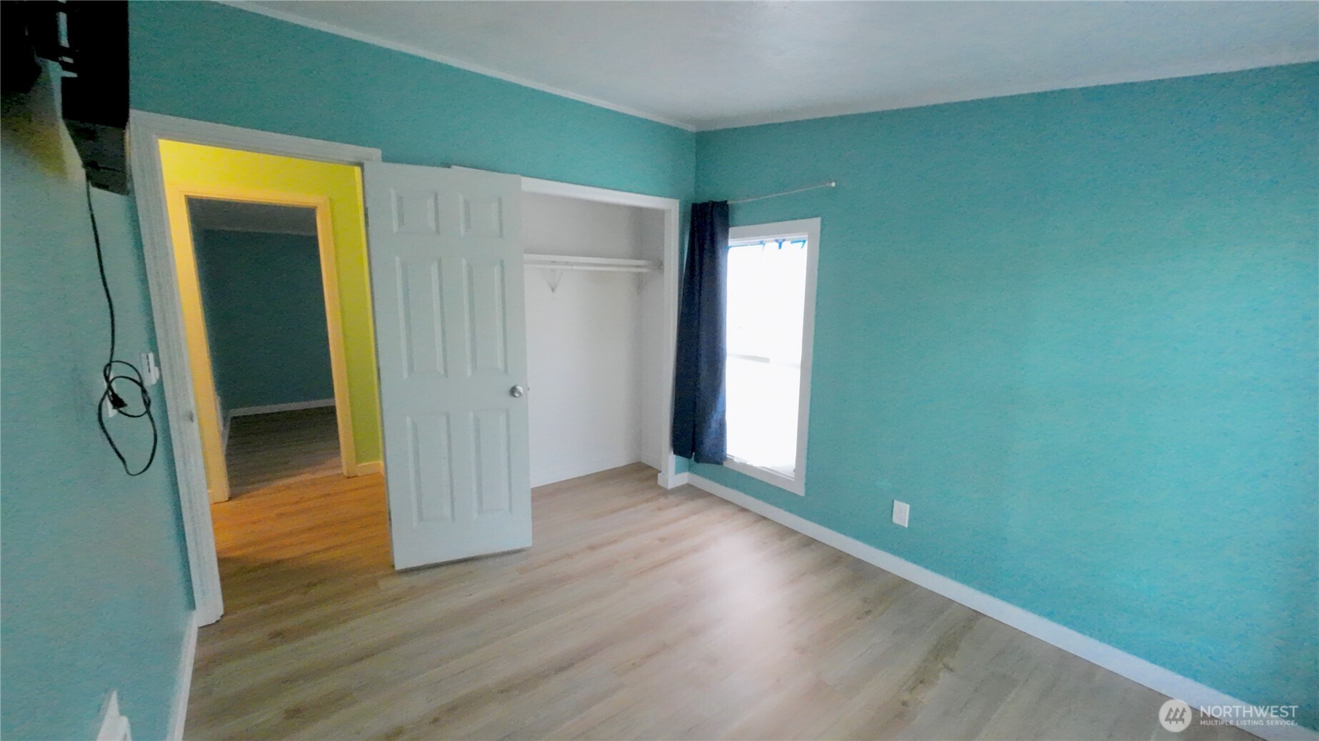 4672 Birch Bay Lynden Road, Unit 82 Blaine, WA 98230 - Photo 21 of 22 an empty room with wooden floor and closet