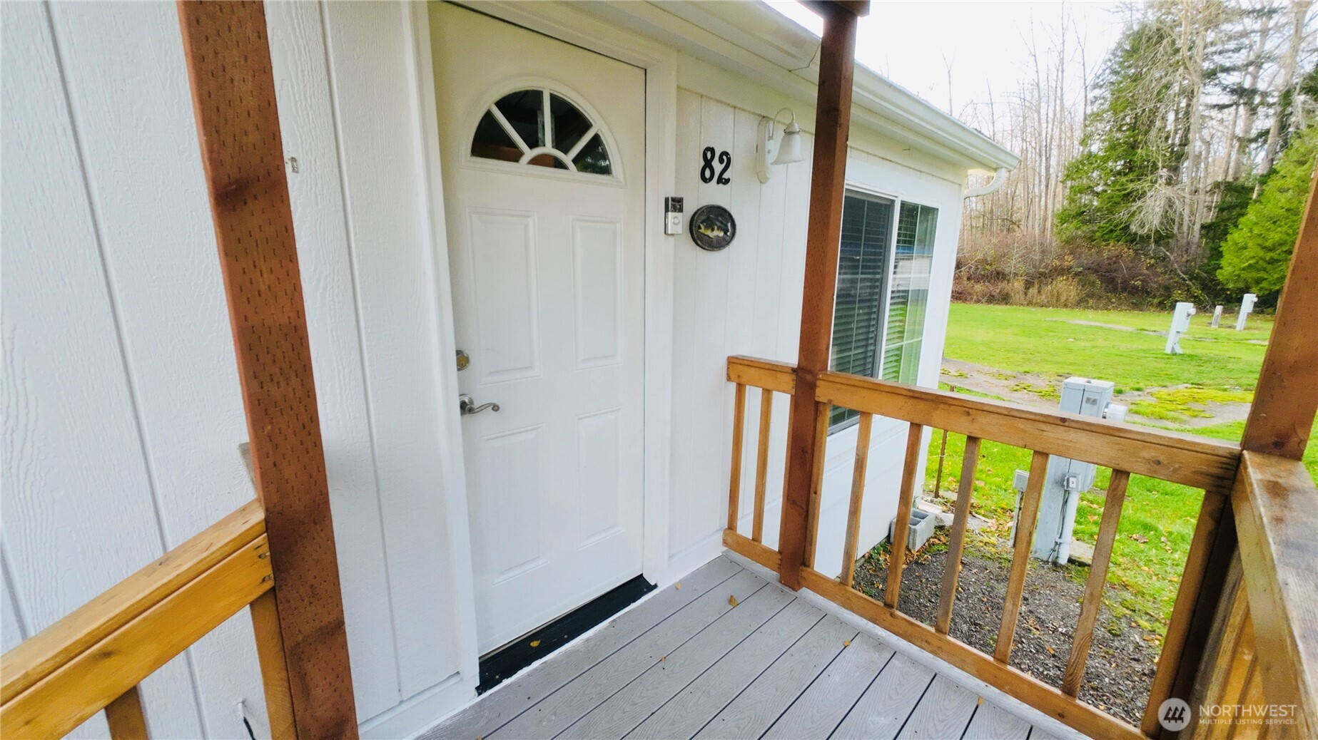 4672 Birch Bay Lynden Road, Unit 82 Blaine, WA 98230 - Photo 3 of 22 a view of a porch with wooden floor and yard