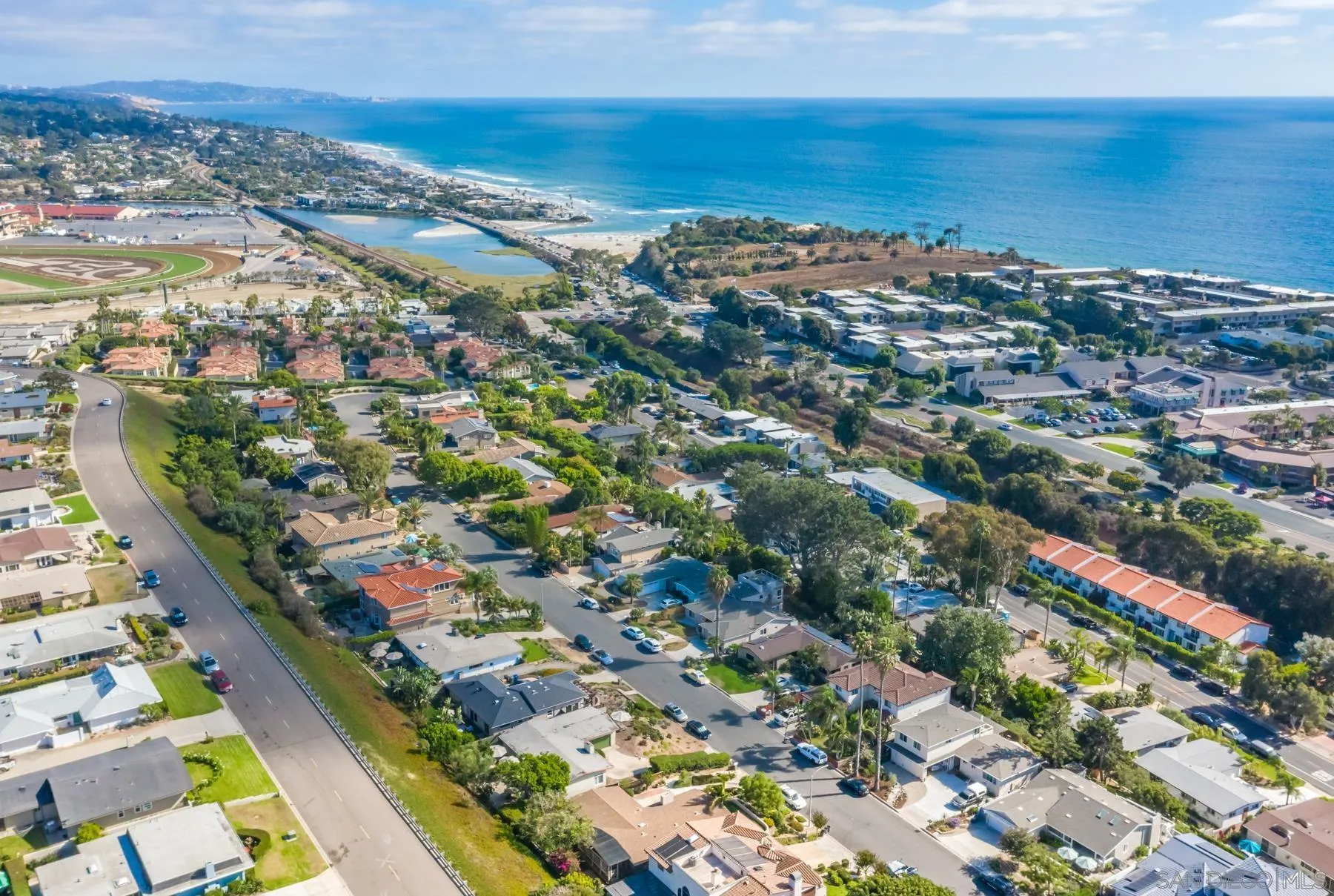 an aerial view of a city with ocean view