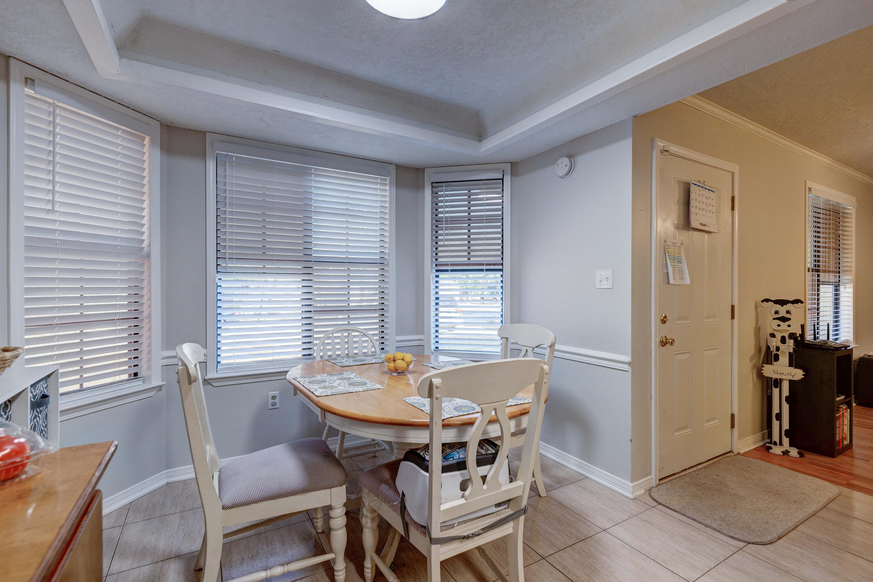 104 Fairoaks Drive Crestview, FL 32539 - Photo 11 of 24 a view of a dining room with furniture and window