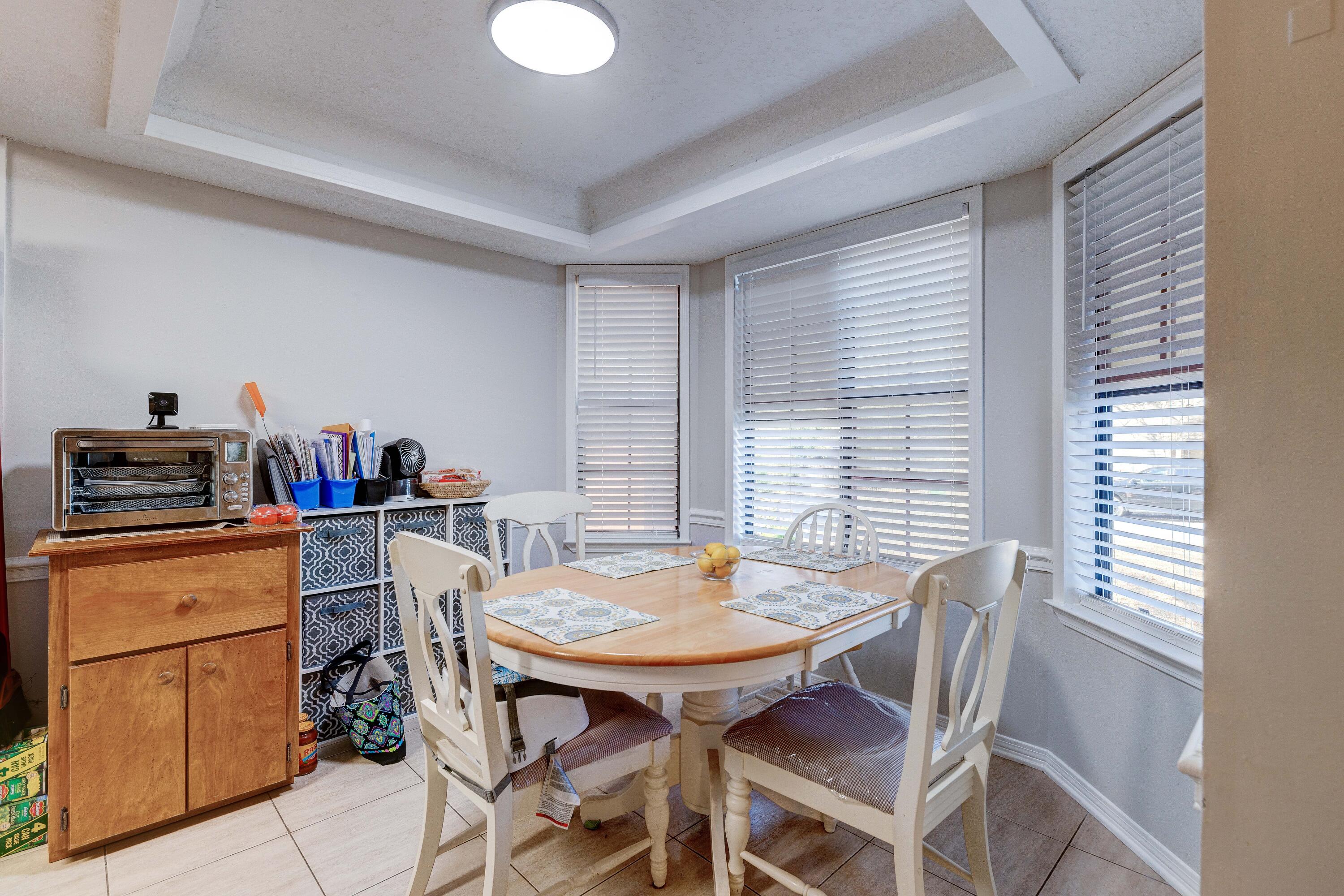 104 Fairoaks Drive Crestview, FL 32539 - Photo 12 of 24 a view of a dining room with furniture and a window