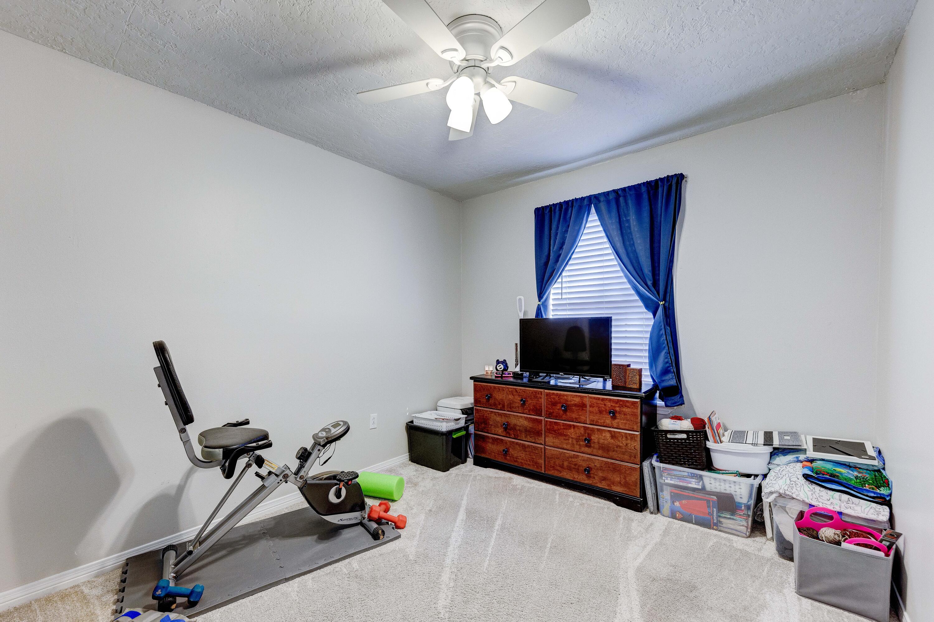104 Fairoaks Drive Crestview, FL 32539 - Photo 18 of 24 a living room with furniture and a flat screen tv
