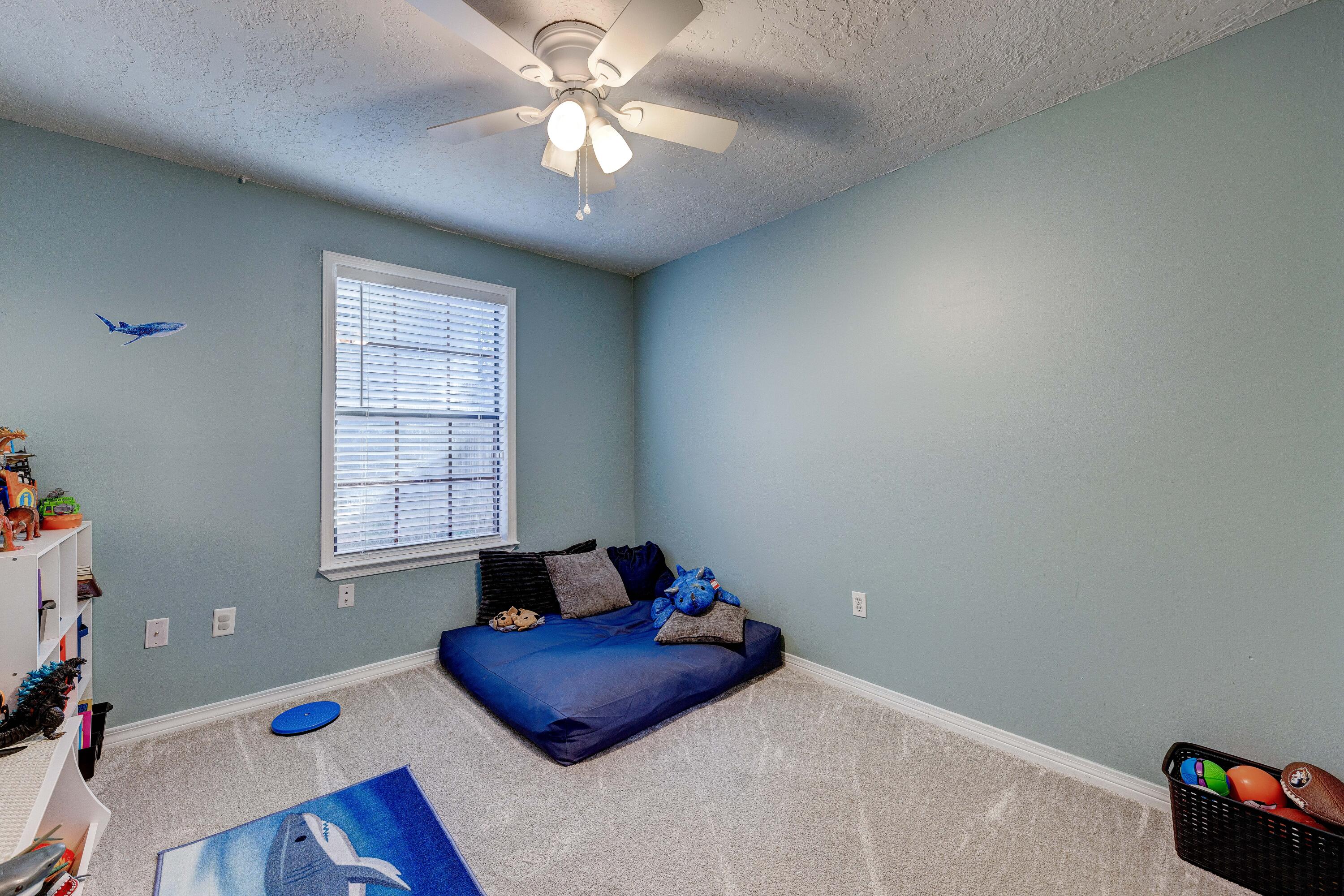 104 Fairoaks Drive Crestview, FL 32539 - Photo 20 of 24 a bedroom with a bed and a window